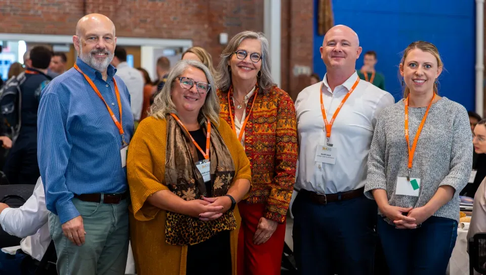 A group of UNE researchers and administrators pose for a photo